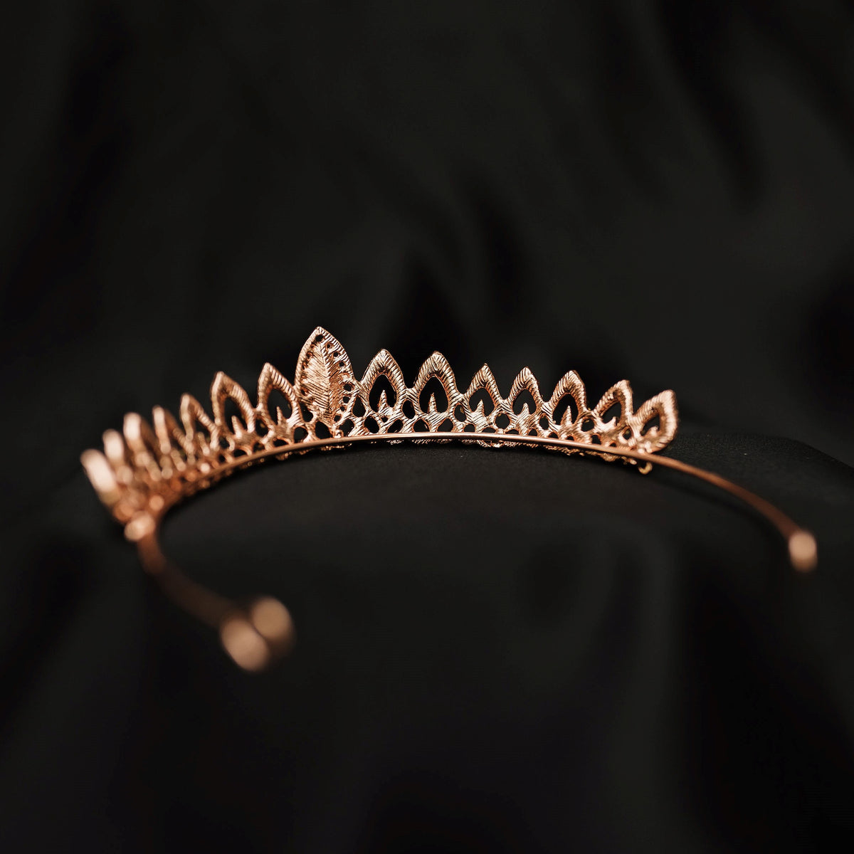 Rose gold tiara on a black background