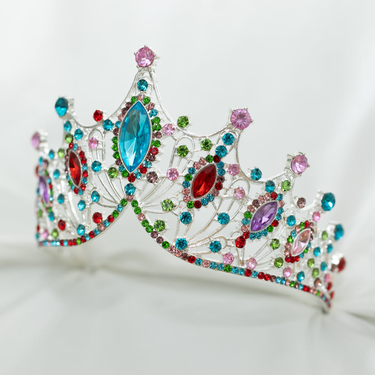 Colorful tiara with gemstones on a white background