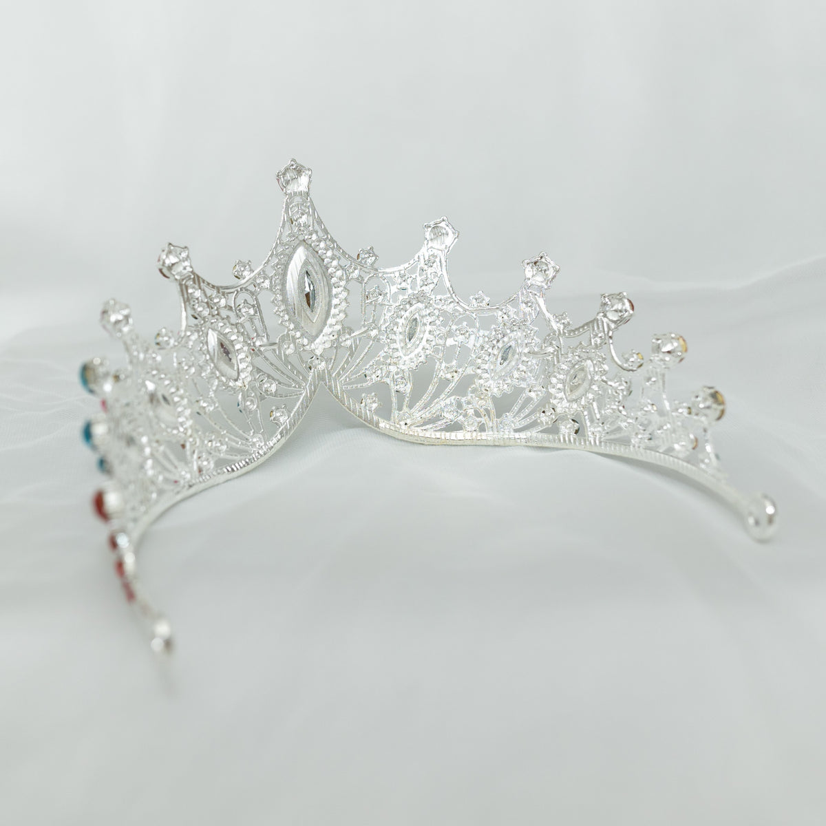 Silver tiara on a light gray background