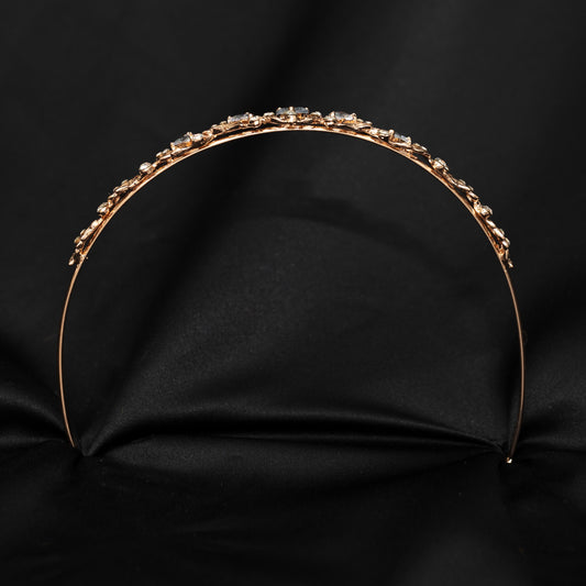 Gold headband with small stones on a black background