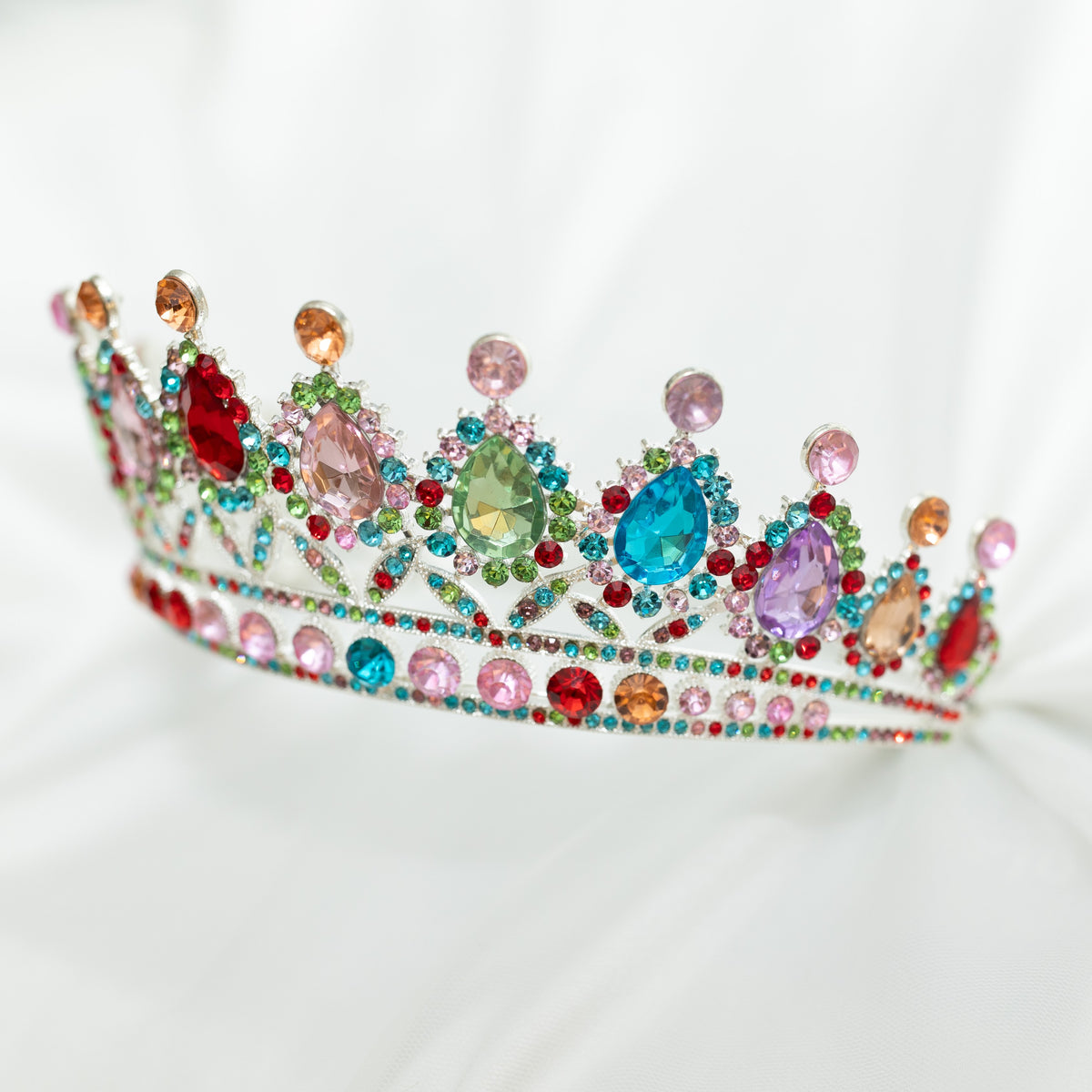 Colorful tiara with gemstones on a white background