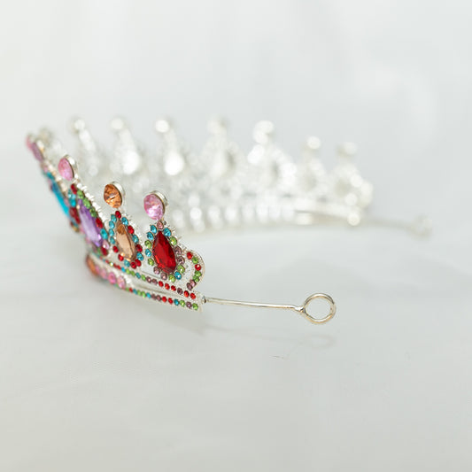 Colorful jeweled tiara on a white background