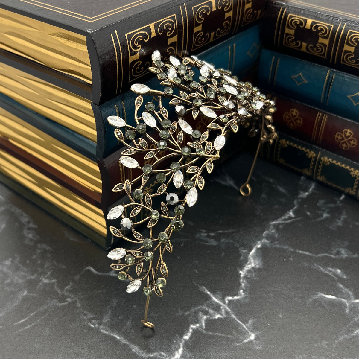 Antique Gold Finished metal with clear and gray crystals in vine design _Angled Side