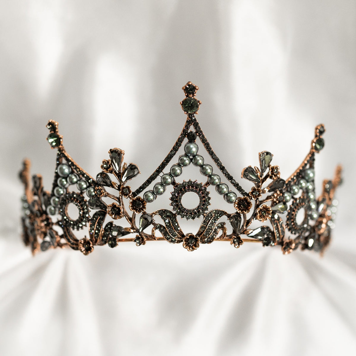 Decorative tiara with intricate design on a white background