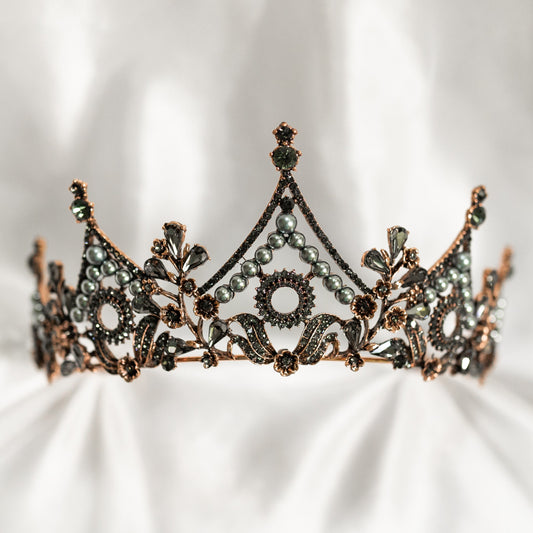 Decorative tiara with intricate design on a white background