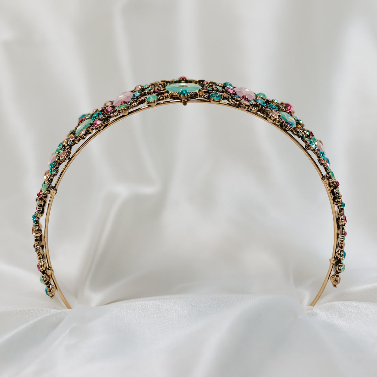 Tiara with multi color tear drop stones, light blue, light ping, teal, with small round stones throughout set in antique gold color metal - Bottom View 