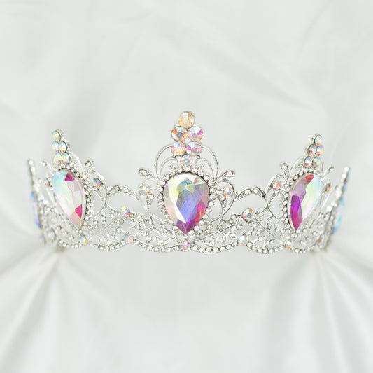 Elegant silver tiara with colorful gemstones on a white background