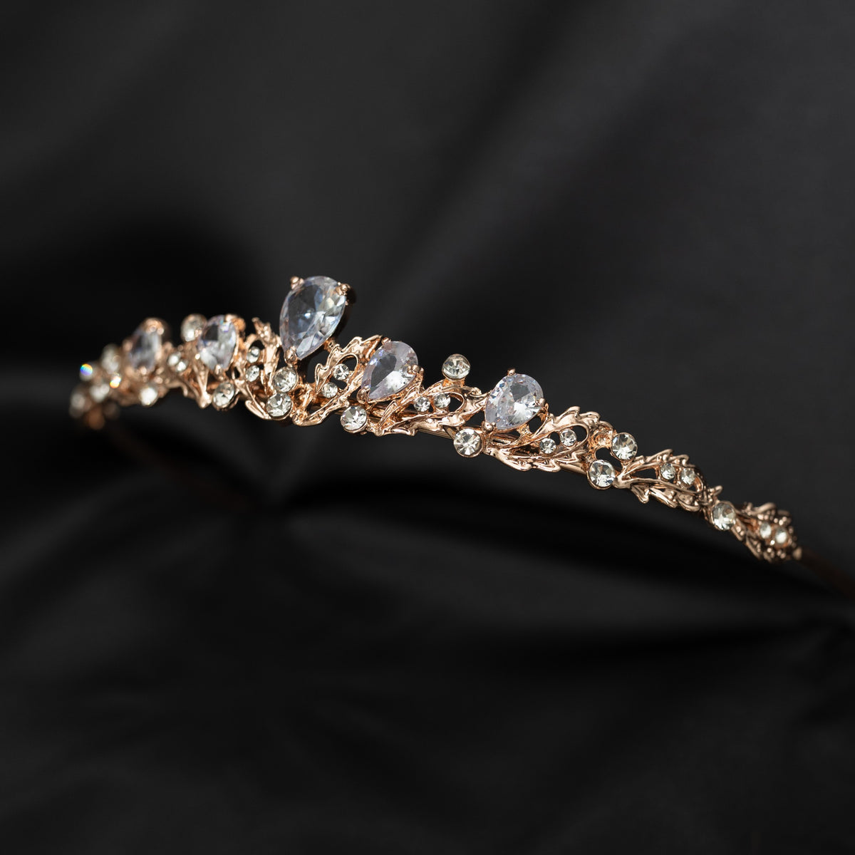 Gold tiara with diamonds on a black background