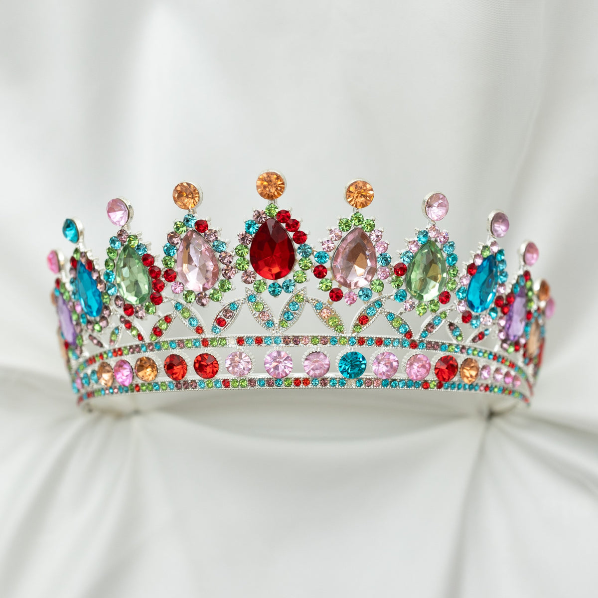 Colorful tiara with gemstones on a white background