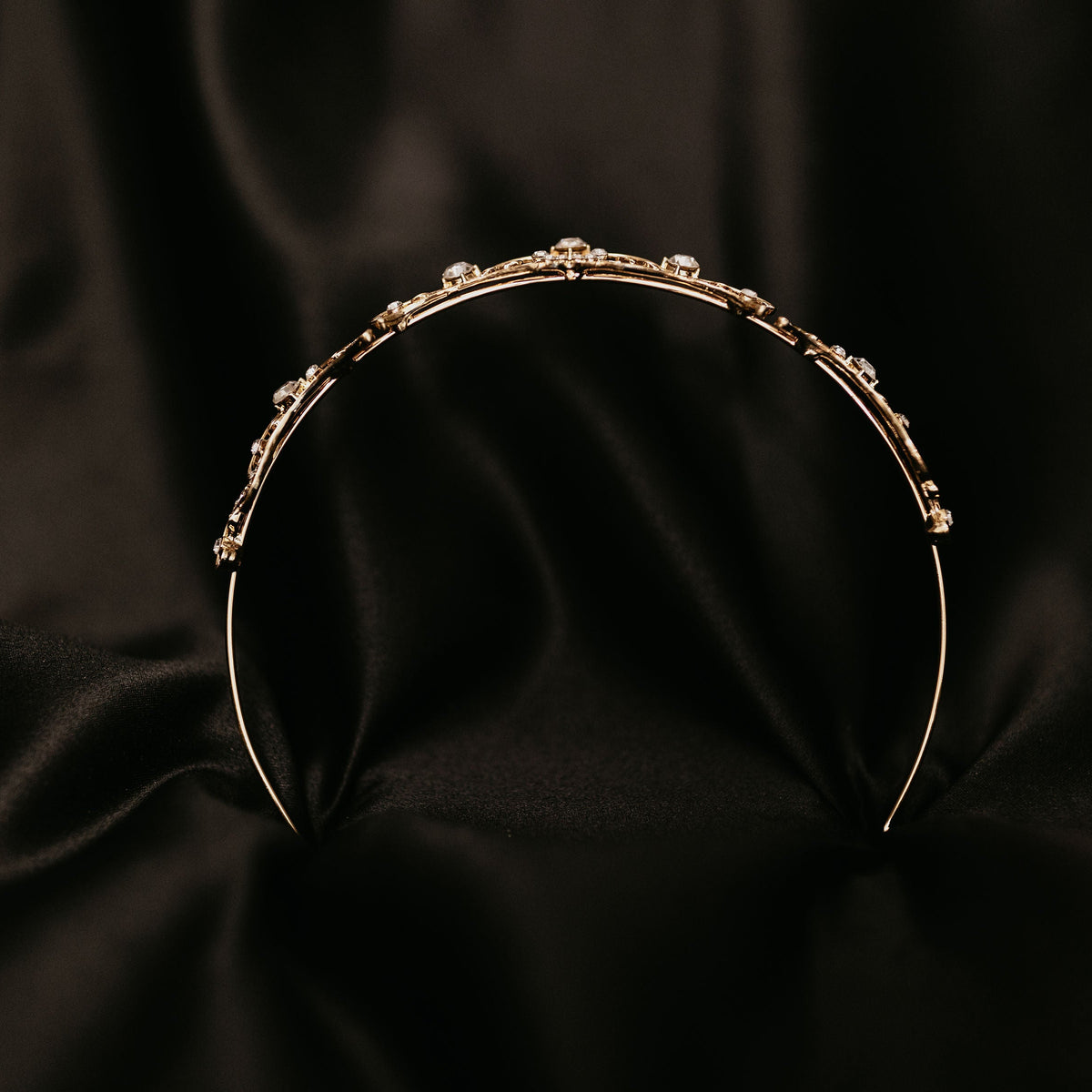 Elegant minimalist gold tiara with delicate crystal accents and classic curved design - Bottom View

