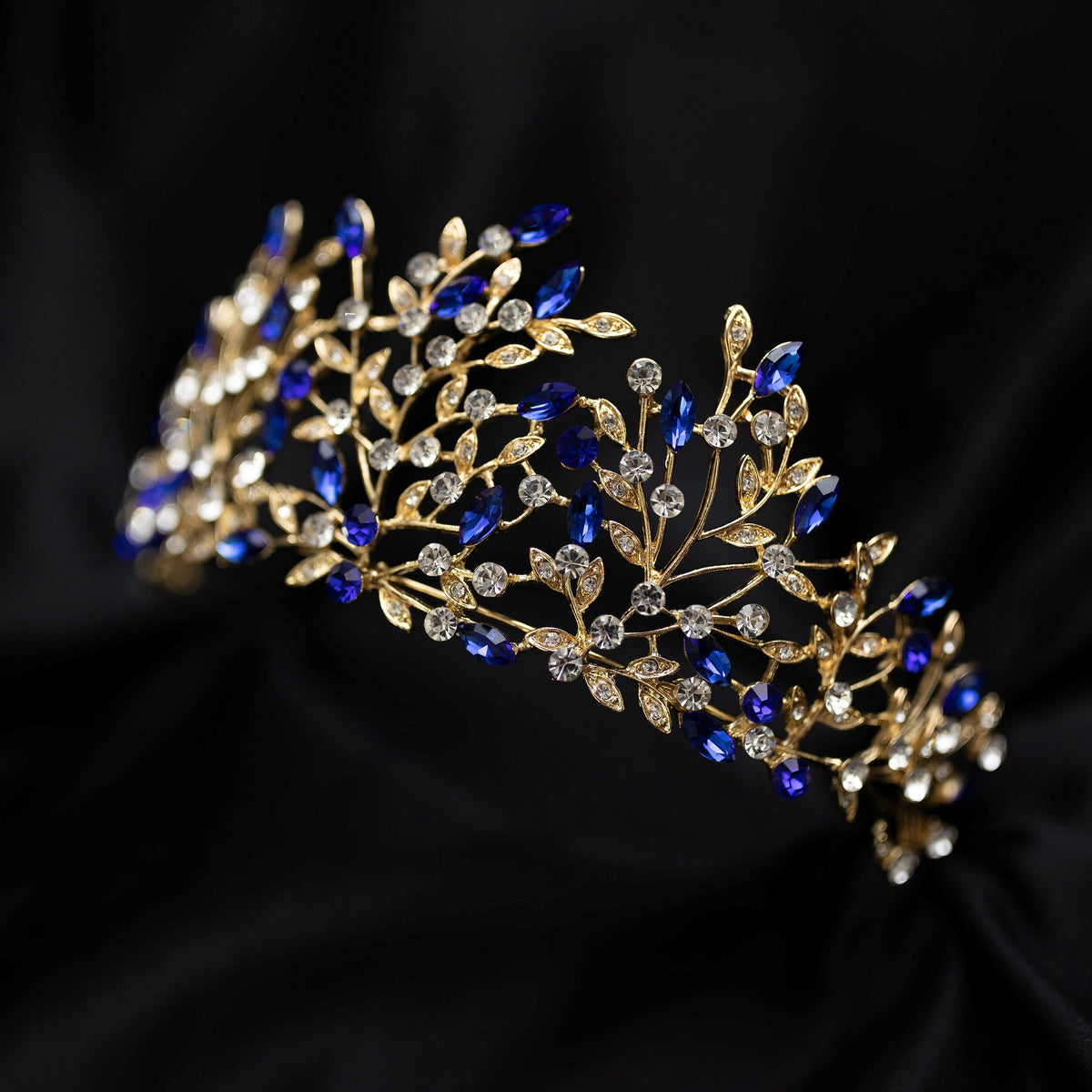 Ingrid's Tiara in Blue Color Crystals, Faux Sapphire, Clear Crystal Faux Diamond, Gold Color Metal, Leaf and Vine Detail, Mother Nature Goddess, Medium Size - Angle View