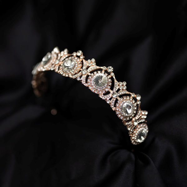 rose gold tiara with circular clear glass crystal details, round clear glass crystals _ Front Angle 