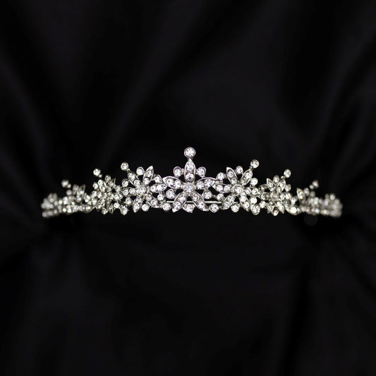 Silver tiara on black background - small crystals with silver metal details in triangular shape - Front view 