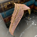 Paola's tiara in pink color crystals, yellow gold color metal, dozens of tiny crystals forming a design of medium size dots to work a single peak center - Angle View