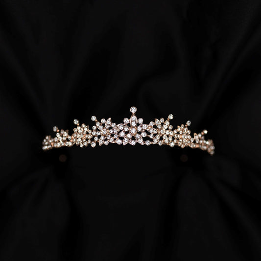 rose gold pink tiara featuring small round clear crystals forming 5 pointed star flower shapes - front view 