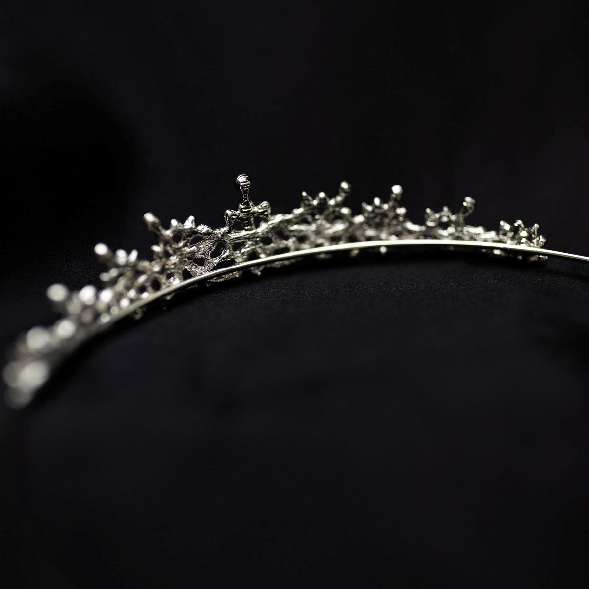 Silver tiara on black background - small crystals with silver metal details in triangular shape - Back view 