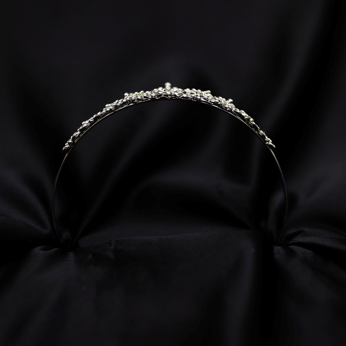 Silver tiara on black background - small crystals with silver metal details in triangular shape - Bottom view 